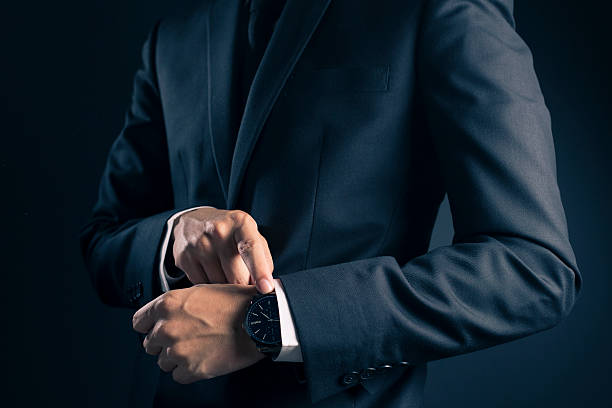 istock Businessman checking time from watch 533715392