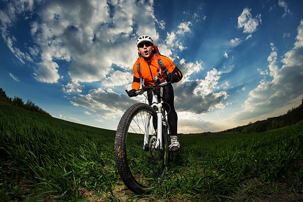 istock Man Cyclist with bike on sunset 533716176
