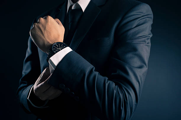 istock Businessman Fixing Cufflinks his Suit 533716798