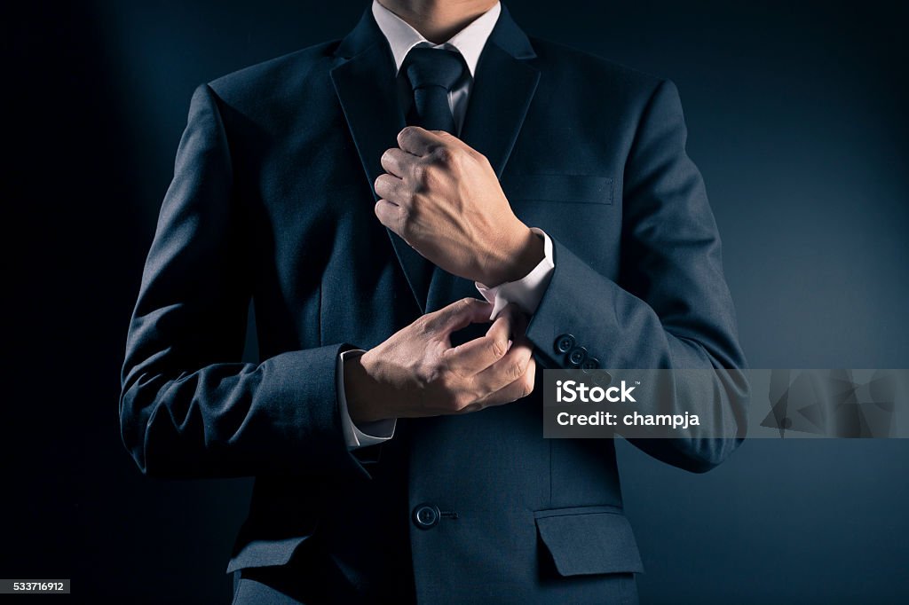 Businessman Fixing Cufflinks his Suit Suit Stock Photo