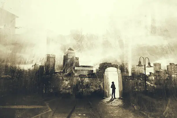 Photo of Man walking in a mystic dark city