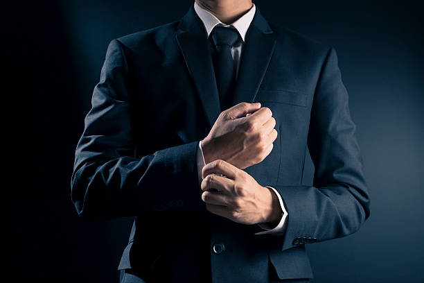 istock Businessman Fixing Cufflinks his Suit 533716982