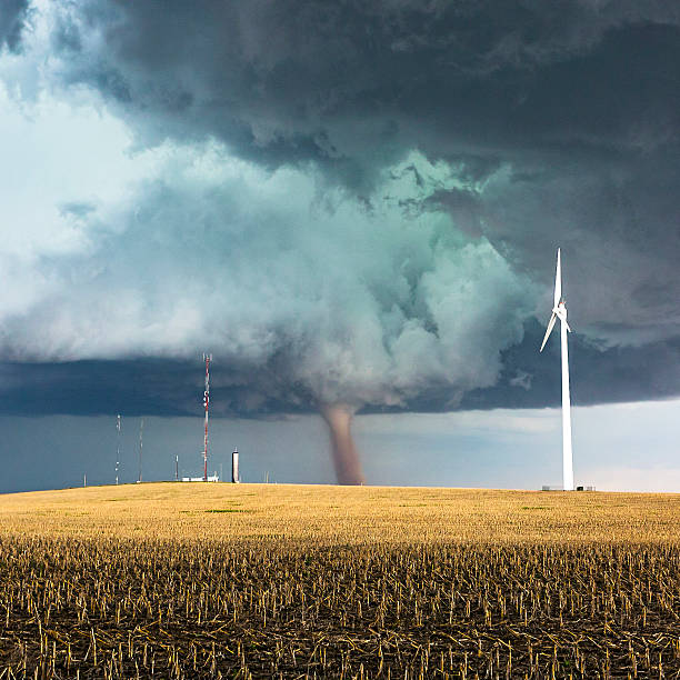 istock Dangerous tornado with wind generator and telecommunications towers 533717052
