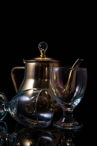 istock Transparant Glass with Brass Tea Cup and Reflection 533717116