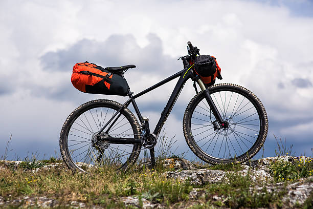 istock Bicycle with orange bags for travel 533717428