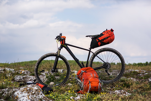 Mountain Bicycle outdoor with orange bags for travel