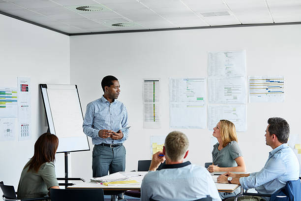 istock Making his presentation to the team 533719118