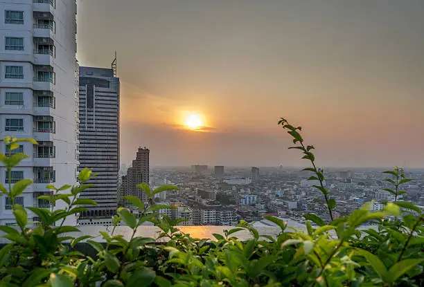 Cityscape: Sunset and the city view of low rises buildings in Bangkok, Thailand