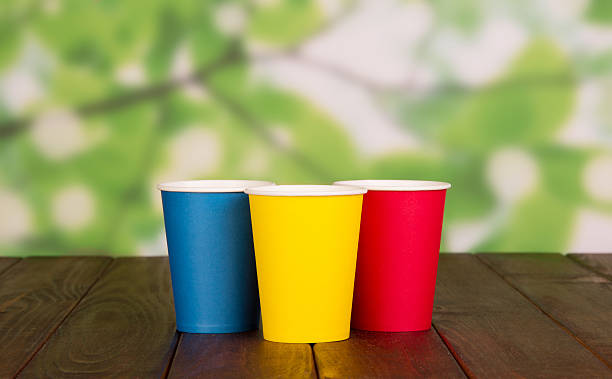 istock Bright disposable glasses on abstract green 533721614