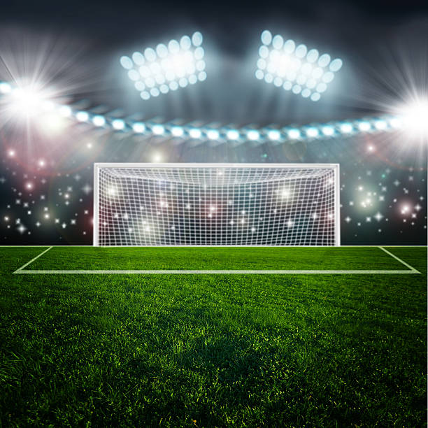 istock Soccer ball on green stadium arena 533722127