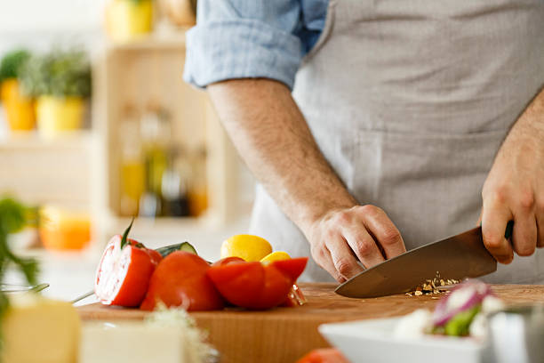 istock Man preparing healthy vegetables salad, cutting almond 533722924