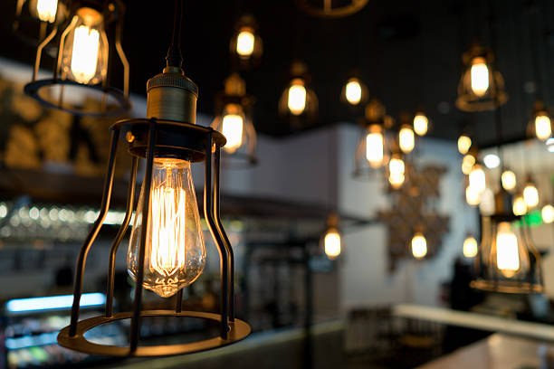 istock Edison bulb glowing in the dark blurred background 533723232