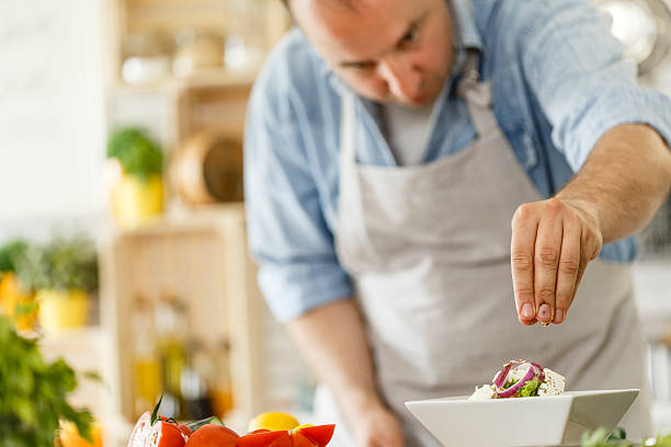 istock Chef decorating a plate with healthy salad 533723290