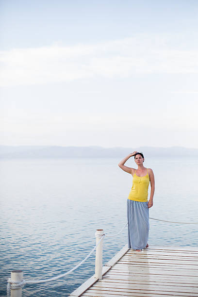 istock Woman on a beach jetty 533723785