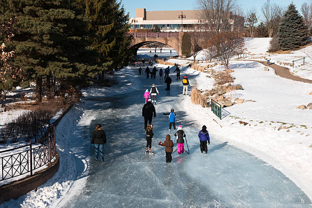 istock People ice skating on a frozen lake 533724313