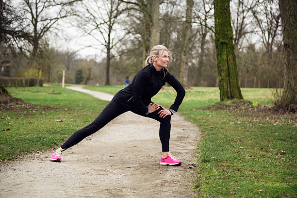 istock attarcive woman stretching in park 533724352