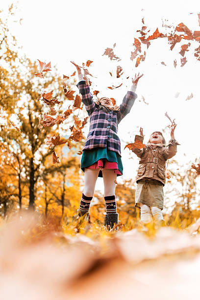 istock Playful sisters in autumn. 533724939