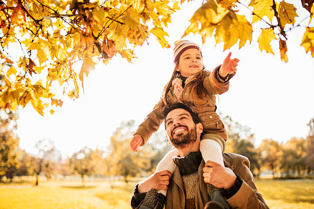 istock Carrying on shoulders during autumn day. 533725211