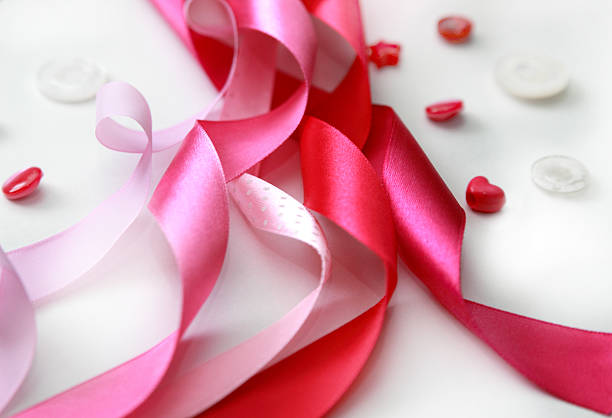 istock pink satin ribbon and buttons 533725341