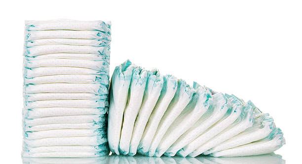 Stacks diapers for children isolated on white background Stacks of diapers for children isolated on white background. Diaper stock pictures, royalty-free photos & images