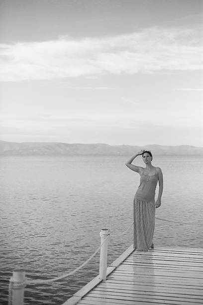 istock Woman on a beach jetty 533726333