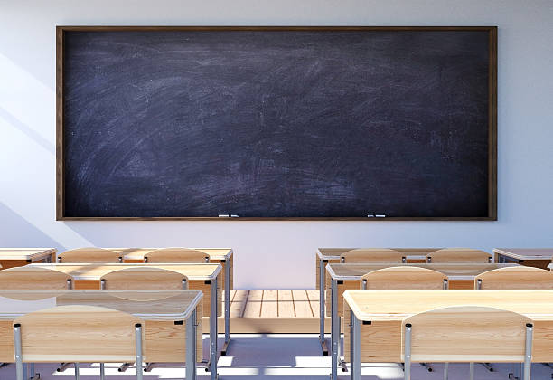 Empty classroom interior with student desk and chairs stock photo