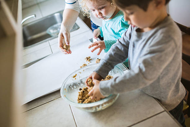 istock Children Baking Cookies with Mom 533726833