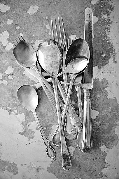 Silver cutlery on metal surface - Monochrome