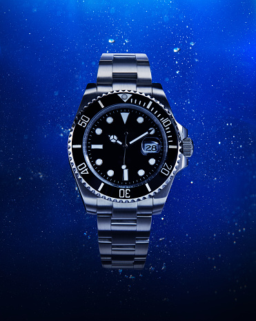Luxury watch with water background.