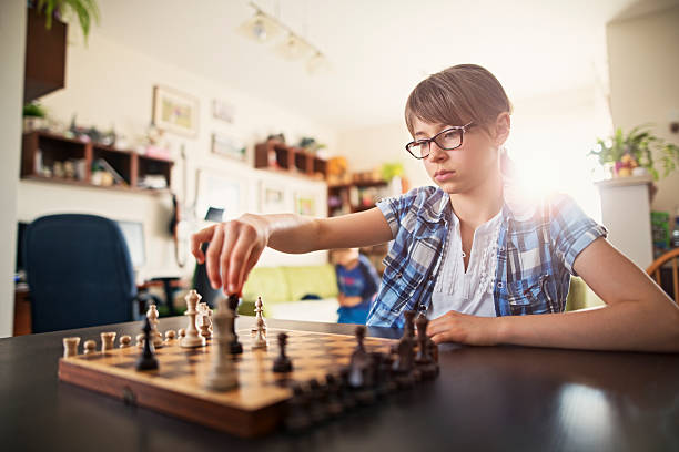 istock Little girl playing chess 533728744