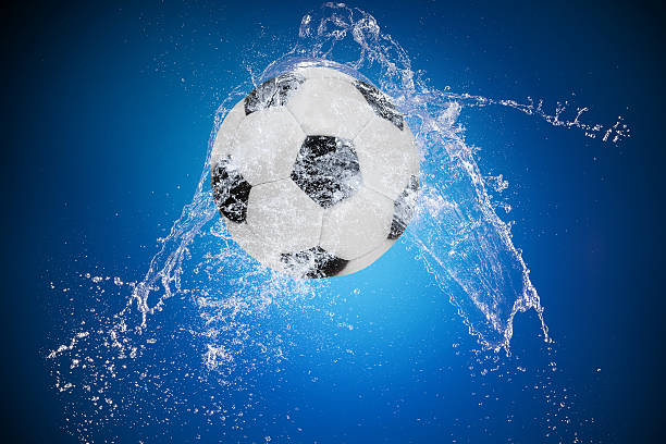 istock Water splash with sport ball 533741483