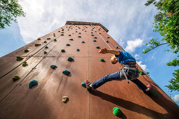 A climber trains and climbs a wall, photo with copy space.
