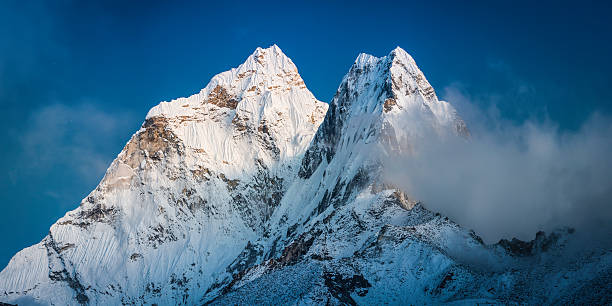 istock White mountain snowy peaks glowing at dusk Himalayas Nepal 533743149