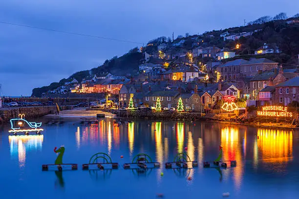 Beautiful display of Christmas Lights at Mousehole Harbour Cornwall England UK Europe