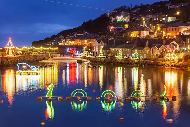 Beautiful display of Christmas Lights at Mousehole Harbour Cornwall England UK Europe