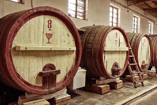 Group of bottles on a wine barrel with copy space