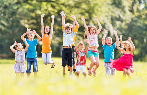 istock Cheerful children jumping in nature. 533745991
