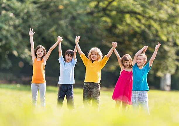 istock Group of children with raised hands. 533745995