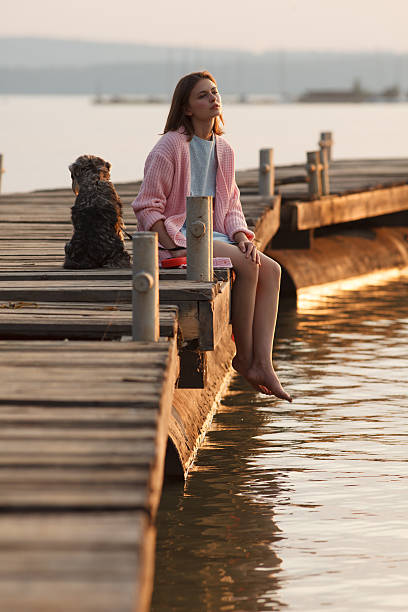 istock Young girl on pier 533746469