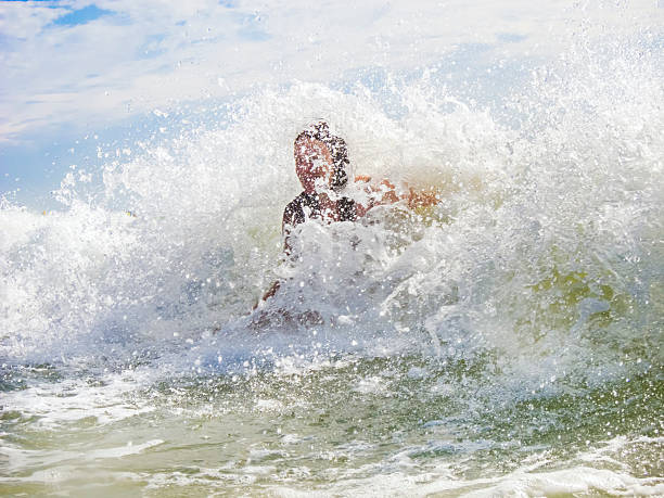 istock woman bathes in the surf 533774473