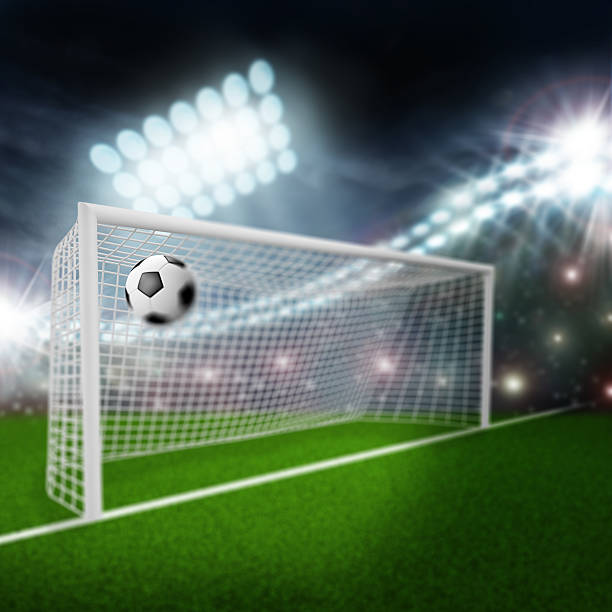 istock soccer ball flies into the goal 533774877