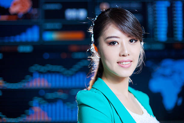 istock Asian successful office lady portrait with digital chart graph background 533775669
