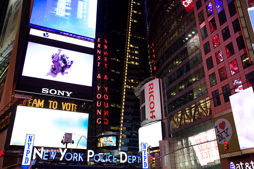 New York, USA - April 06, 2015: Times Square, featured with number of neon signs including New York Police Department, is a famous symbol of New York City and the United States in Manhattan.