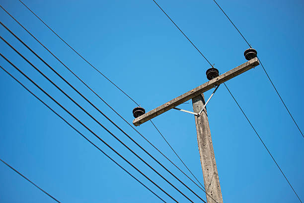 istock electricity post in blue sky at Thailand 533776453