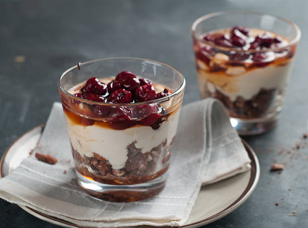 Balck forest dessert Dessert with cherry in a glass (black forest), selective focus trifle stock pictures, royalty-free photos & images