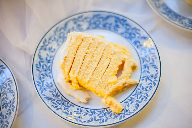 The wedding cake is cut into pieces.