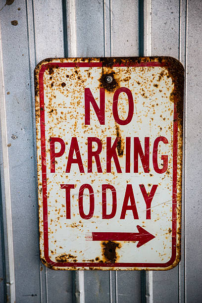 istock Rusty No Parking Today Sign on Rustic Metal Background 533780953
