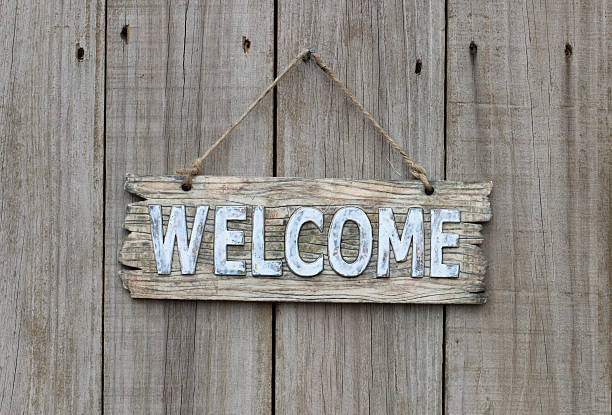 istock Welcome sign hanging on wood door 533831431