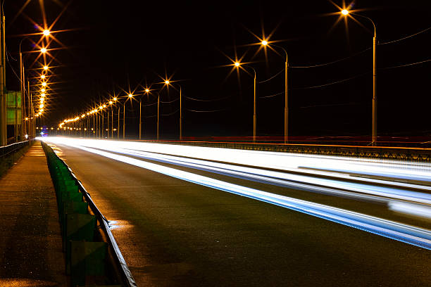 istock moving car with blur light through city 533832872