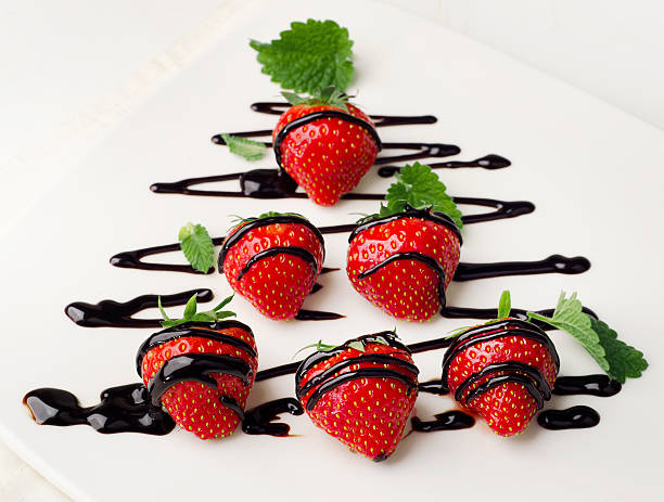 istock Fresh strawberries dipped in chocolate sauce on   plate. 533833755